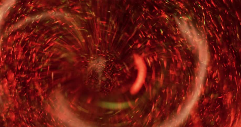Red particles spin around the edges of a swirling vortex and neon green particles move in as it spins