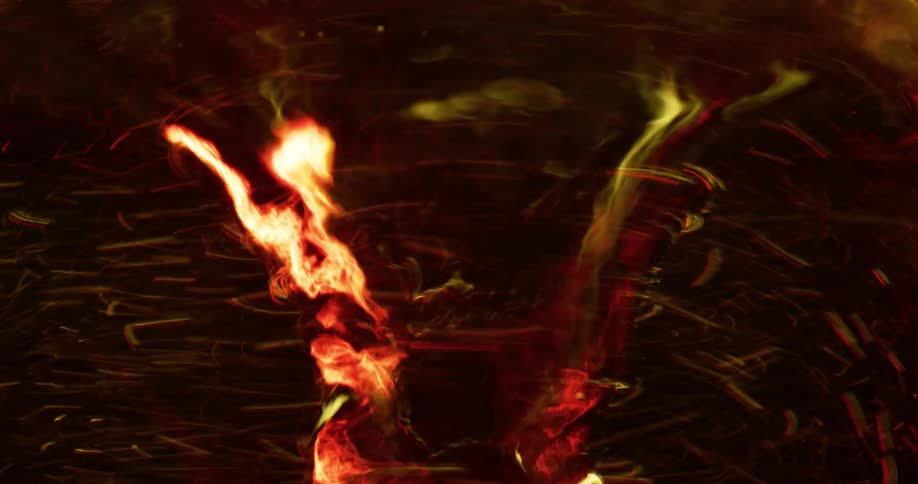Flames and embers swirling and turning in a fire tornado