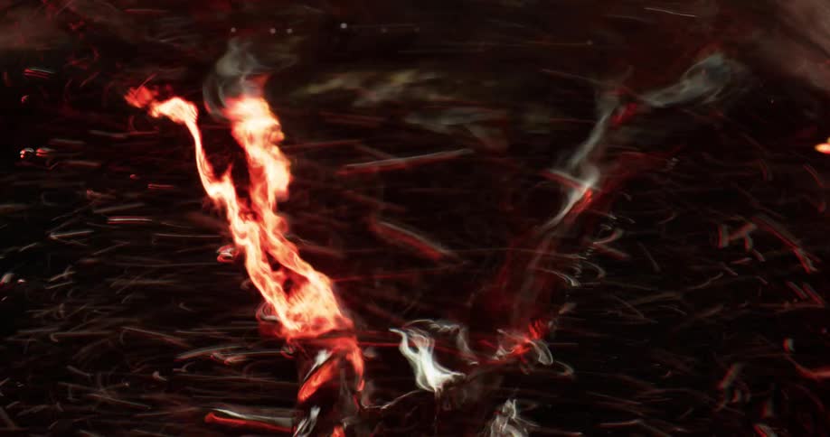 Particles are swirling around a liquid vortex as light reflects on the surface as it ripples and moves