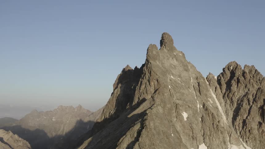 The mountains are high into the clear sky