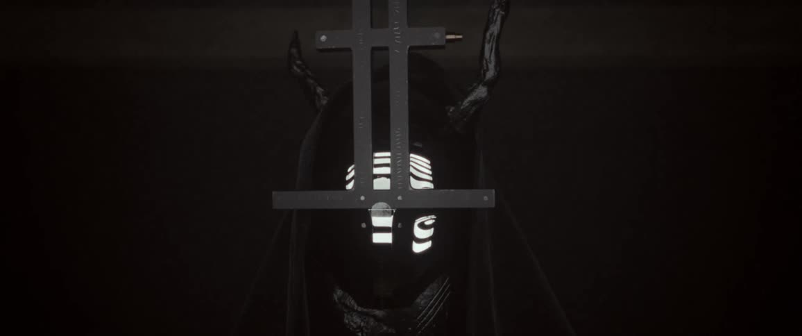 Close up of a mask slowly turning towards camera