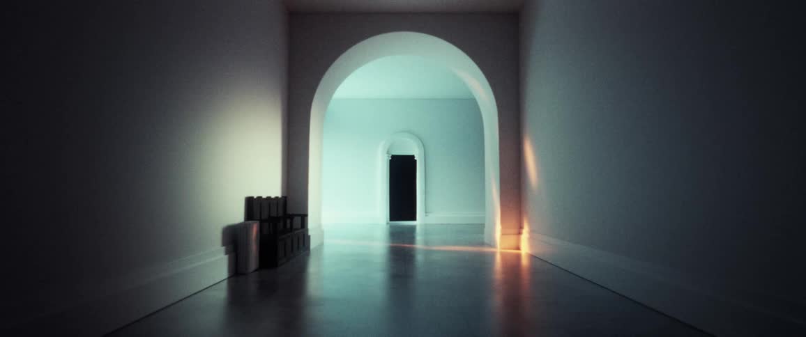 Light shines into large clean hallway through arched opening