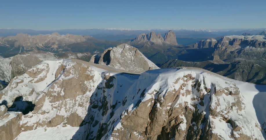 The mountain range is covered with snow and ice