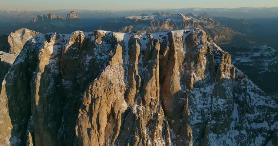 Aerial view of mountains at dusk is displayed