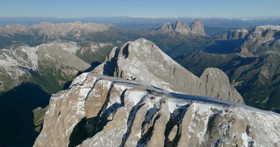 Aerial view of building on top of high mountain in mountainous region