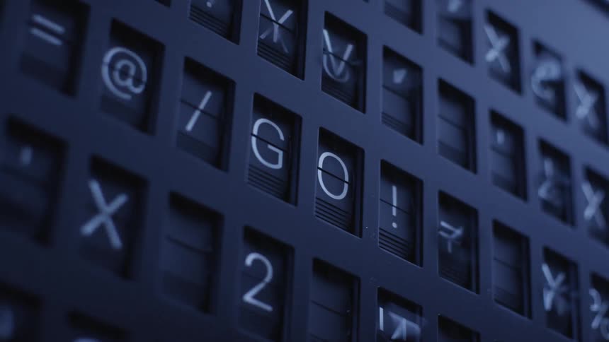 Large flip board display flips through many symbols before leaving the word go
