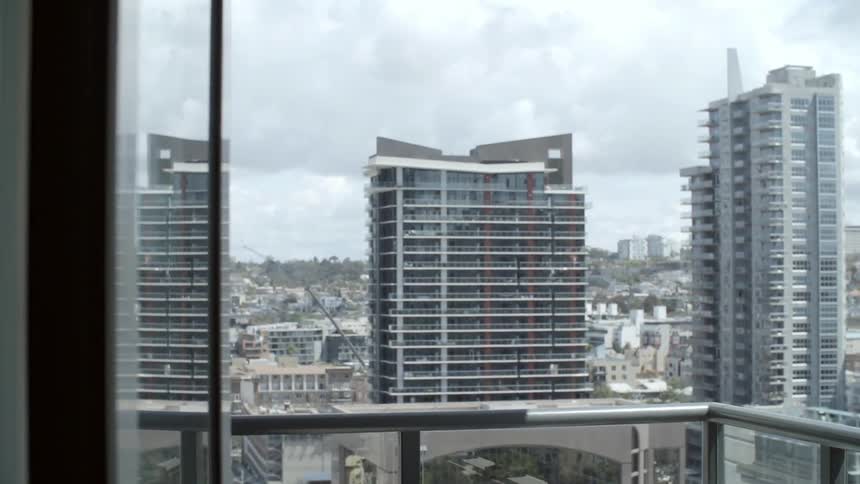 Tall buildings in a city on a cloudy day
