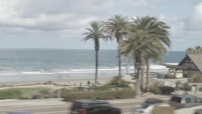 A busy city street near the ocean