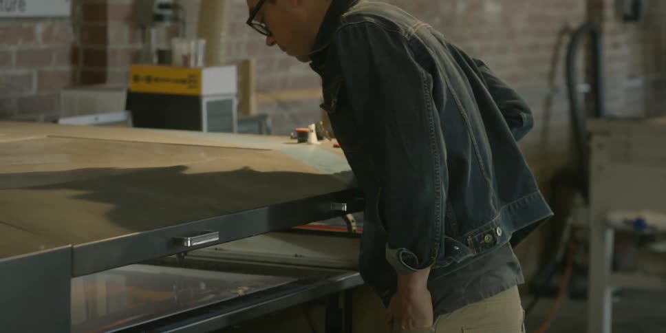 A man looks at machine