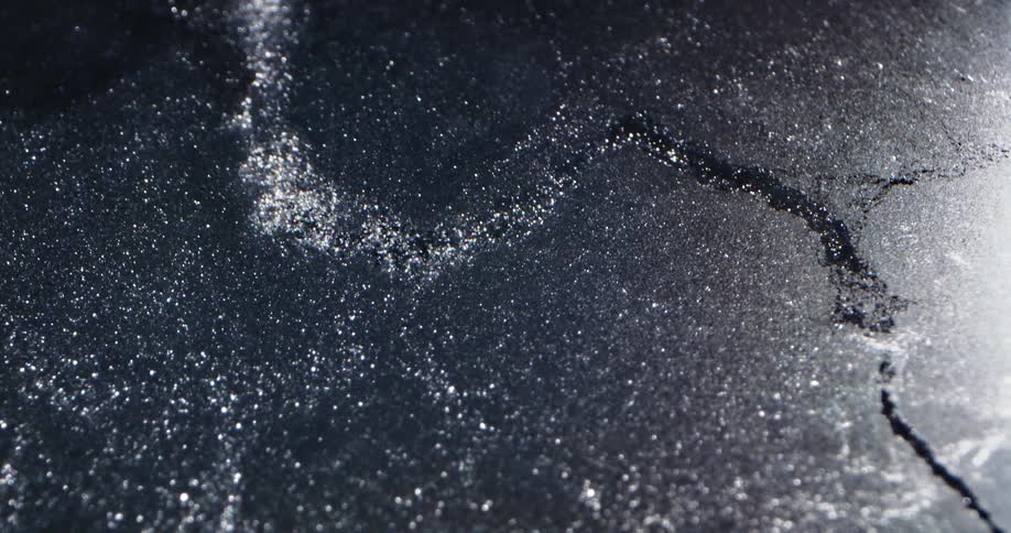 Close up of water bubbling through ice
