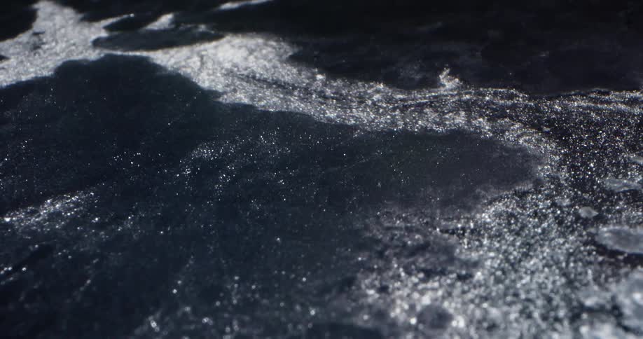 Ice cracking in the flowing water
