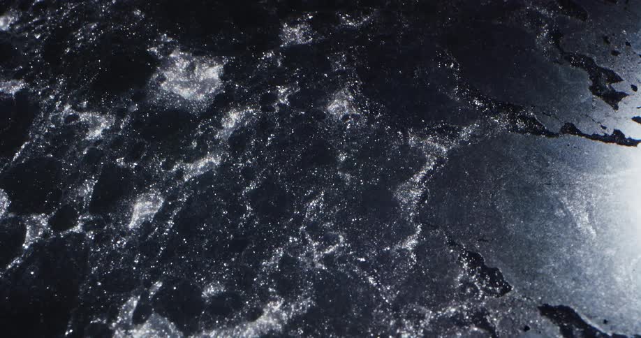 Water flowing past ice in a river