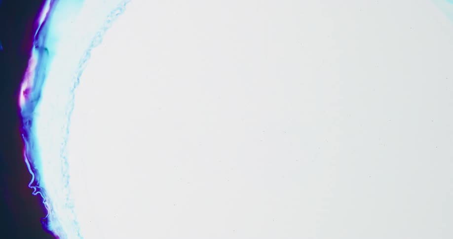 Bright mixture of blues and purples spreads to show bright white center before contracting