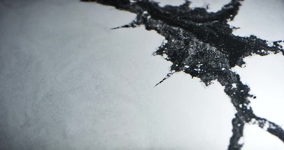 Flowing water breaks through ice and slowly widens crack in ice sheet