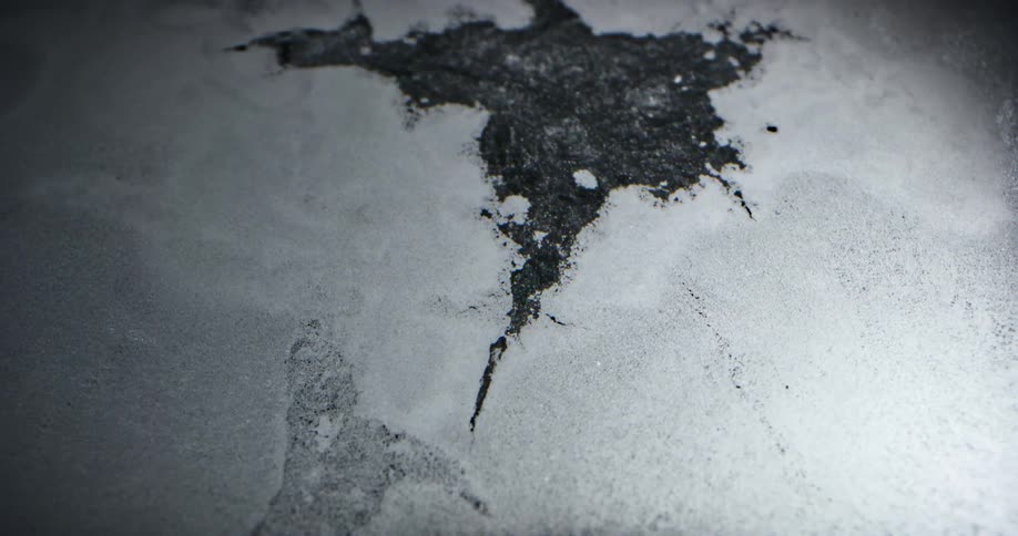 Close up of water bubbling up through ice