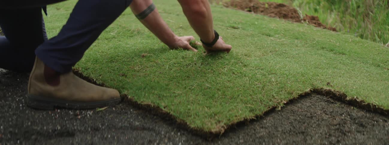 A man is gardening outdoors during the spring time
