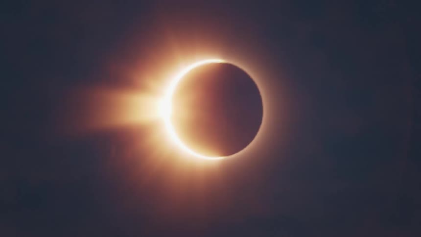 The moon moves across the sun during a solar eclipse