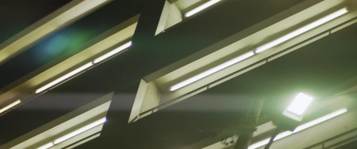 The view is of inside of a building and you can see the sun light through the window