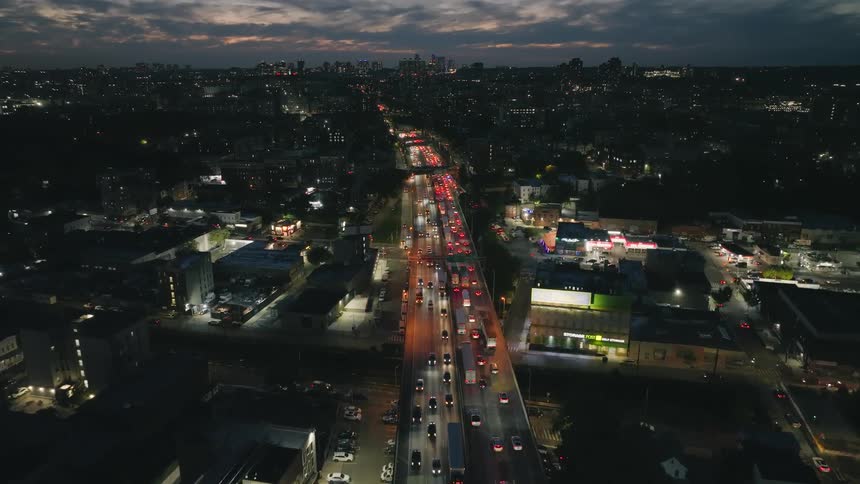 Traffic travels through the city at sunset
