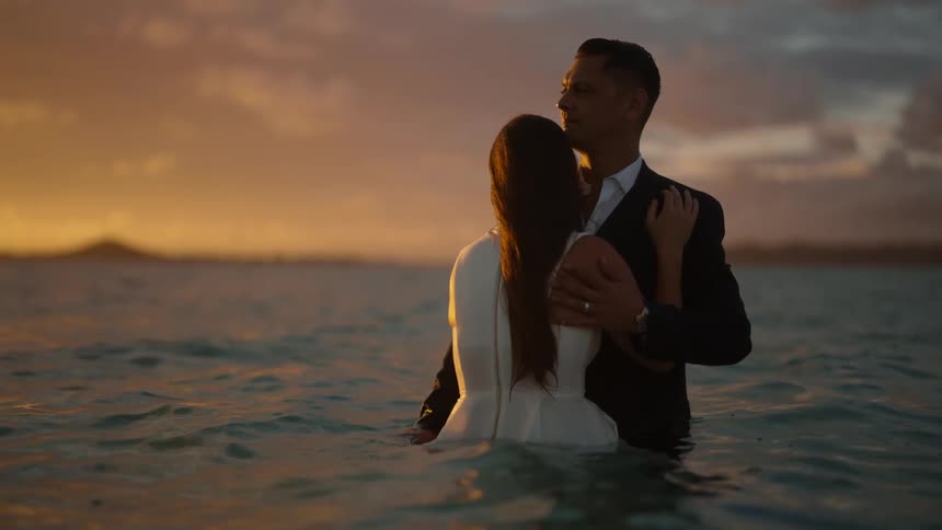 Man and woman are relaxing in the ocean water