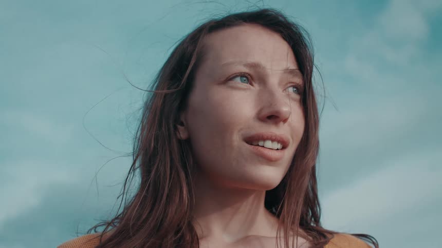 A woman looking out into the distance with awe