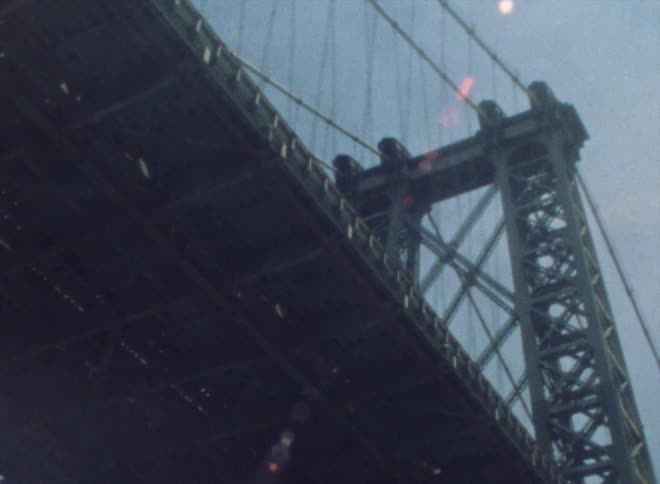 White van crosses suspension bridge