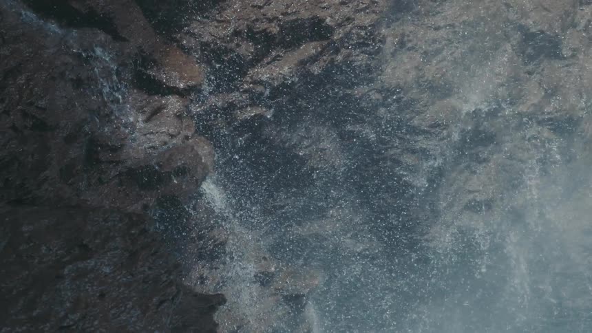 Water splashing over rocks as it cascades down