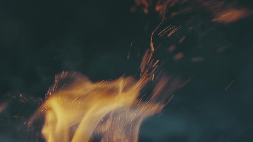A fire rises and moves