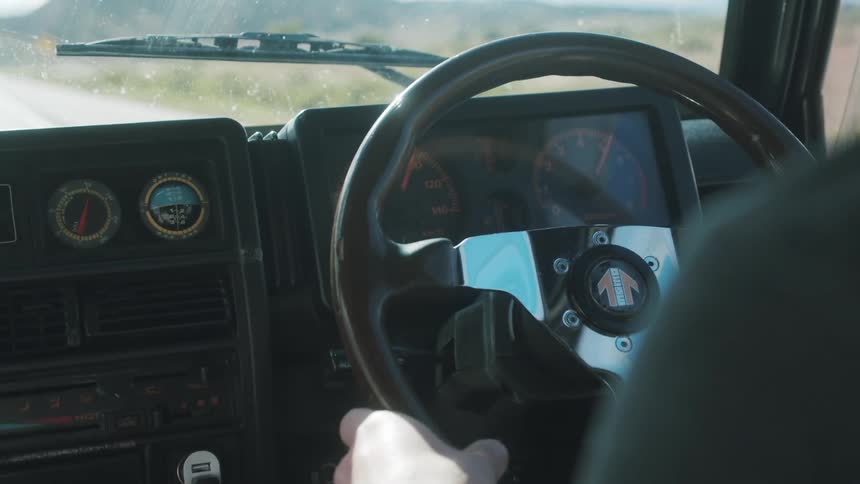 Close up of a man as he drives a car