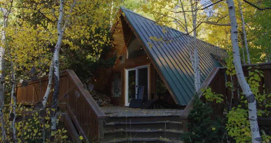 Exterior view of cottage in the autumn forest