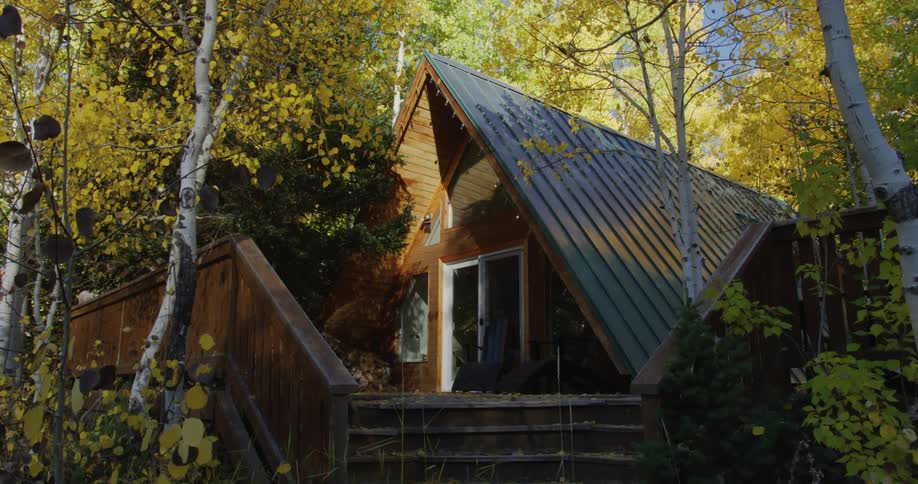 Exterior view of cottage in the autumn woods