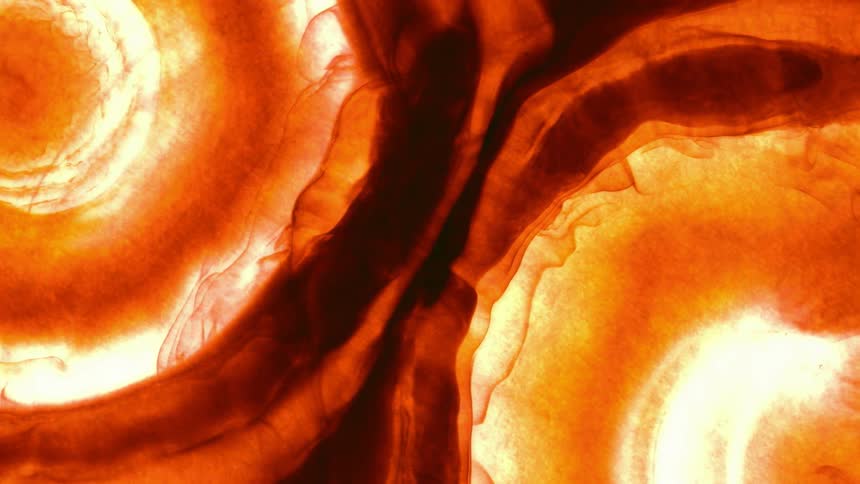 Close up of red and orange liquid waving