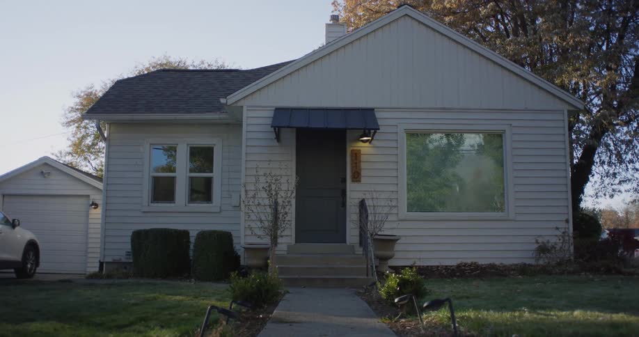 Exterior view of detached house and garage in the neighborhood
