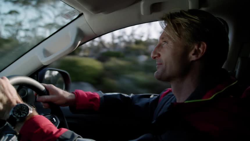 A man uses wireless technology to talk on the phone while driving
