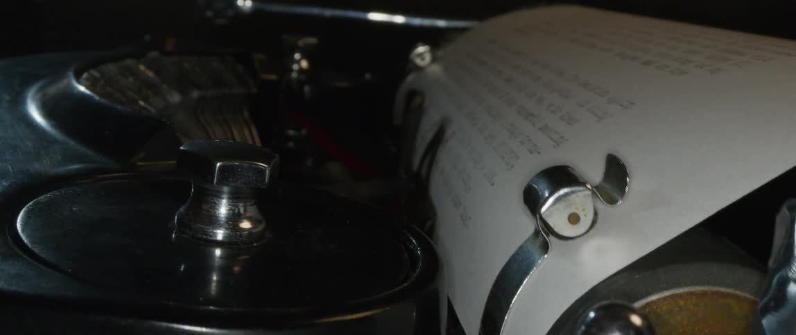 A document is typed on a vintage typewriter