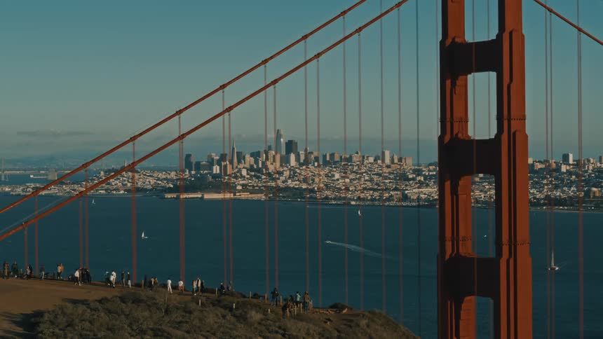A group of people are looking at the San Francisco Bay