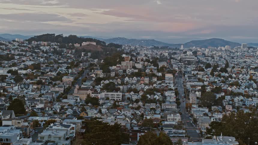An aerial view of houses in a a neighborhood in a city