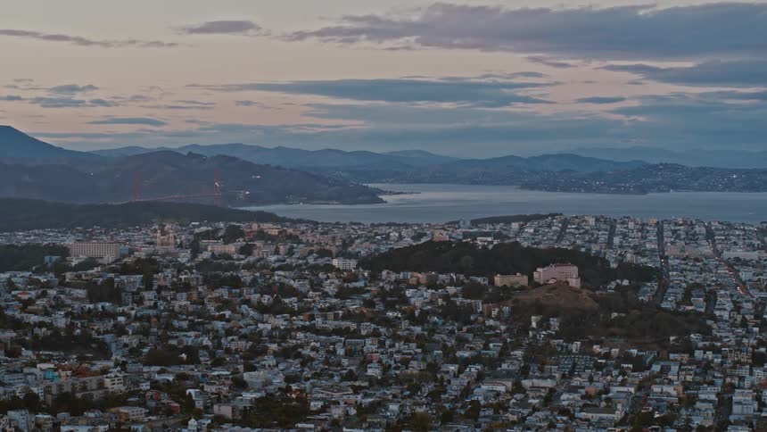 San Francisco homes sit close together with the Golden Gate Bridge in the distance