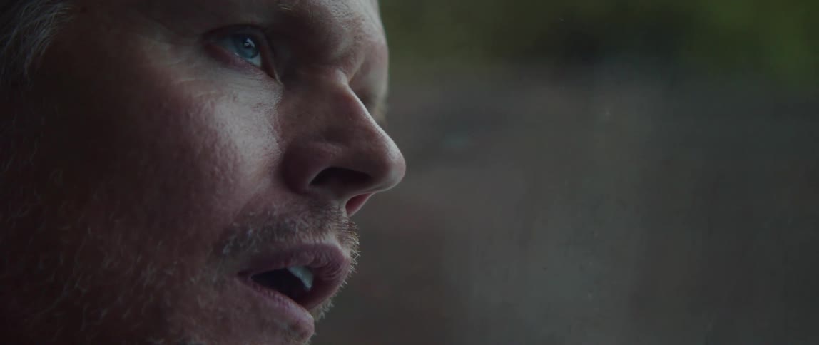 Close up view of a mans face while standing outdoors