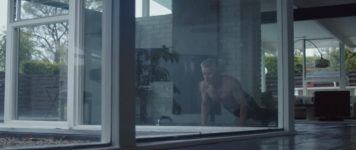 A man exercises in his home