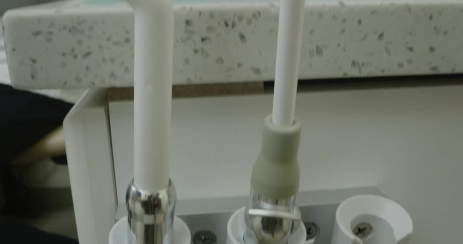 Dental professional accesses instrument attached to tube