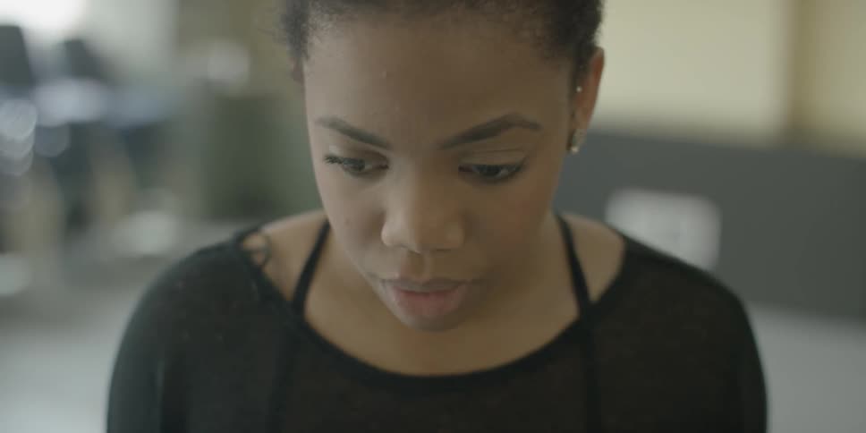 A woman looks pensive