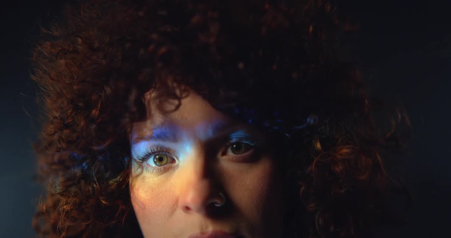 Close up view of a womans face is displayed