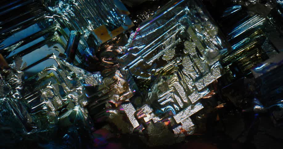 A light moves over a textured gemstone