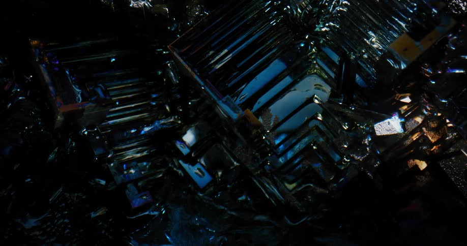A light shines over a translucent blue gemstone