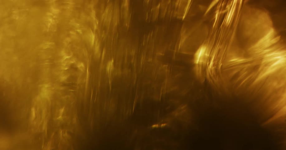Amber smoke and liquid moving around
