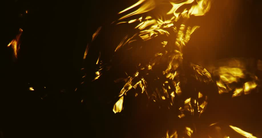 Light appears in the darkness as it wavers and shimmers