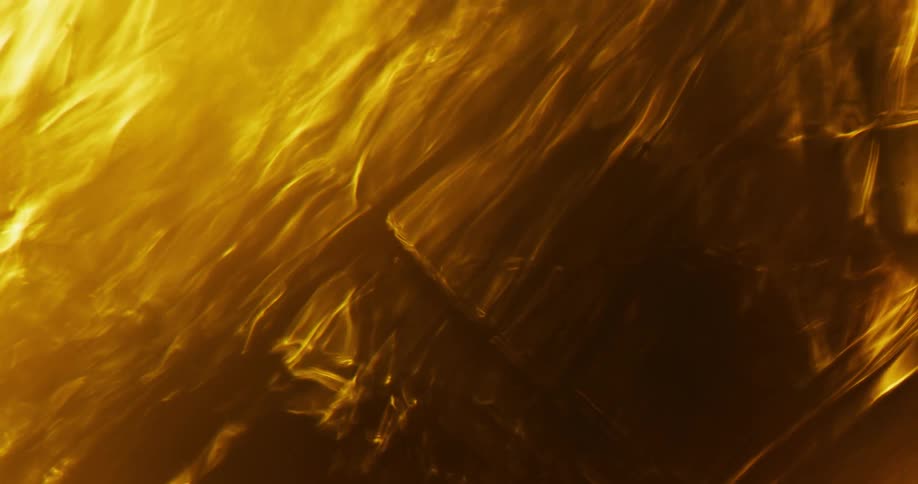 Golden and amber light waves flow in multiple layers