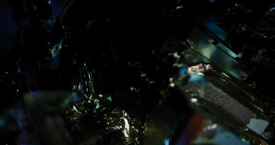 A light moves over a blue tinted crystal