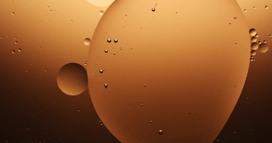 Large bubble inclosing other bubbles divides in to two in coppery liquid
